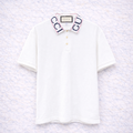 Gucci – Polo Blanc Col GG Brodé